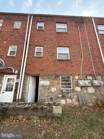 a building view with a brick wall