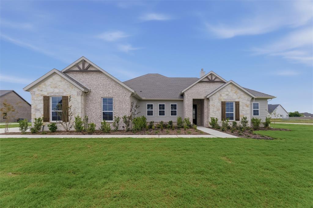 2204 Continent Court Krum, TX 76249 - Photo 3 of 28 Single-story residence featuring a mixed-material facade of light-colored stone and brick