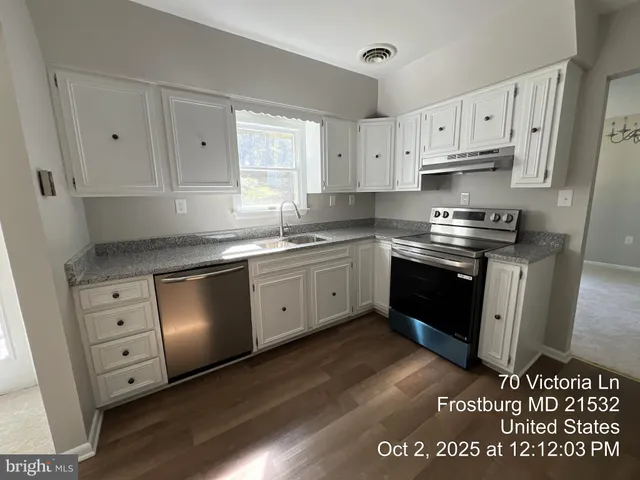 a view of a livingroom with an empty space and a window