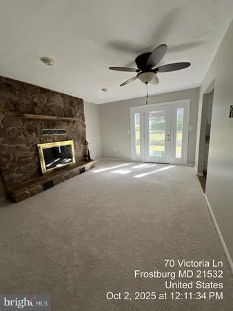 a view of livingroom with an empty space and window