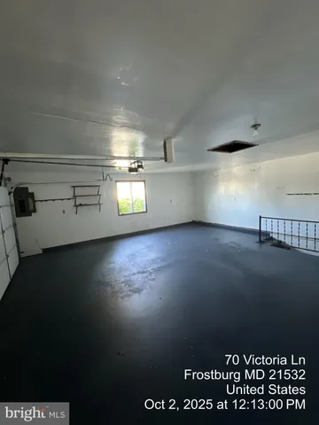 a bathroom with a glass door shower and a toilet