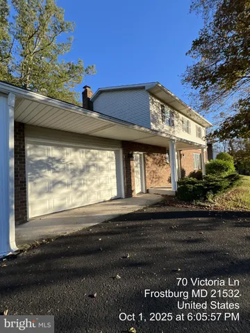 a front view of a house with a garage