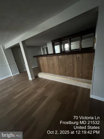 a kitchen with granite countertop a sink and cabinets