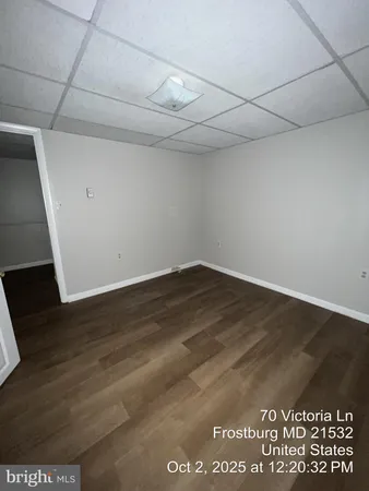 a front view of a house with a yard covered with snow