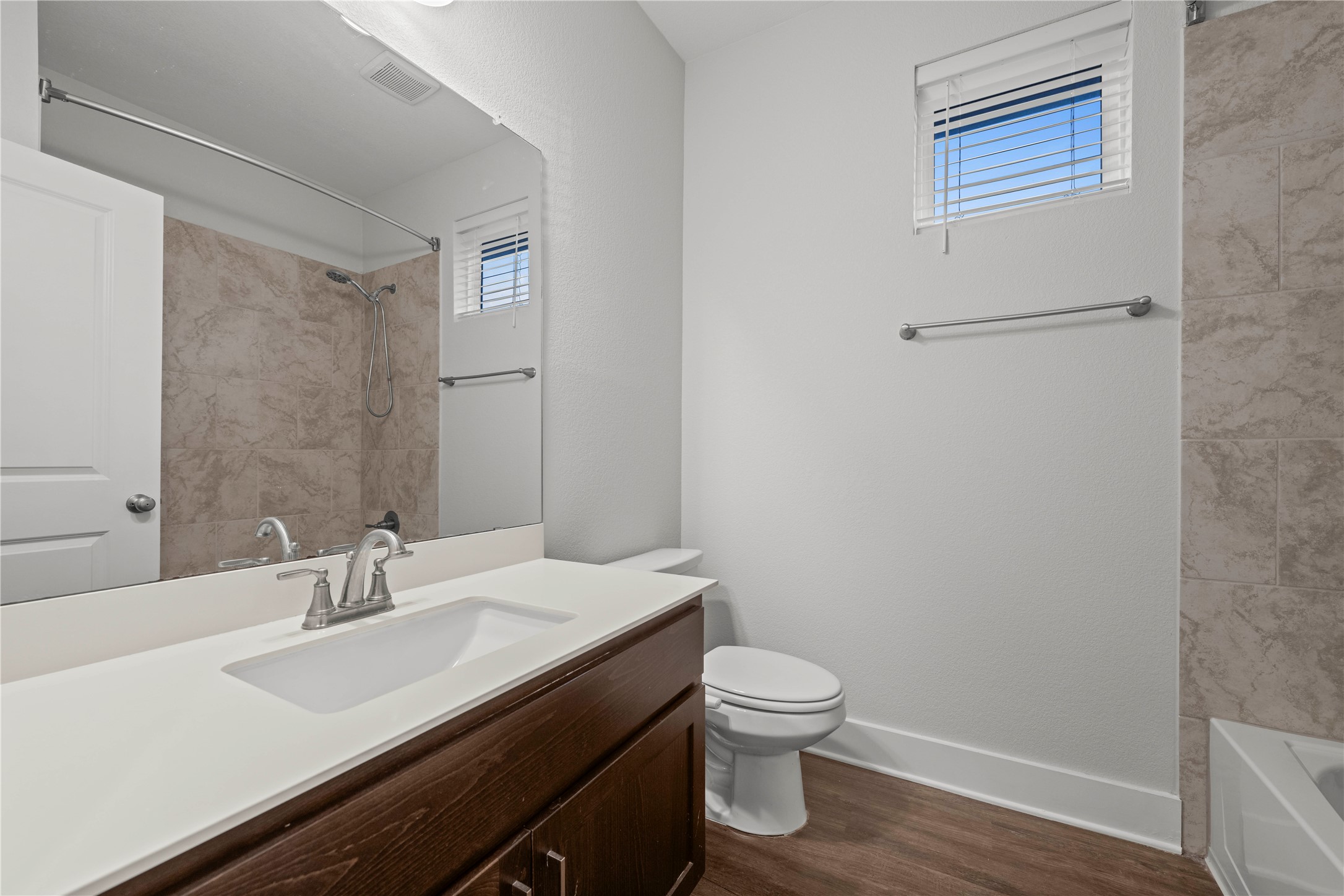 60 Rancho Trail Georgetown, TX 78628 - Photo 29 of 36 A classic vanity and tiled shower accents define this clean bathroom space.