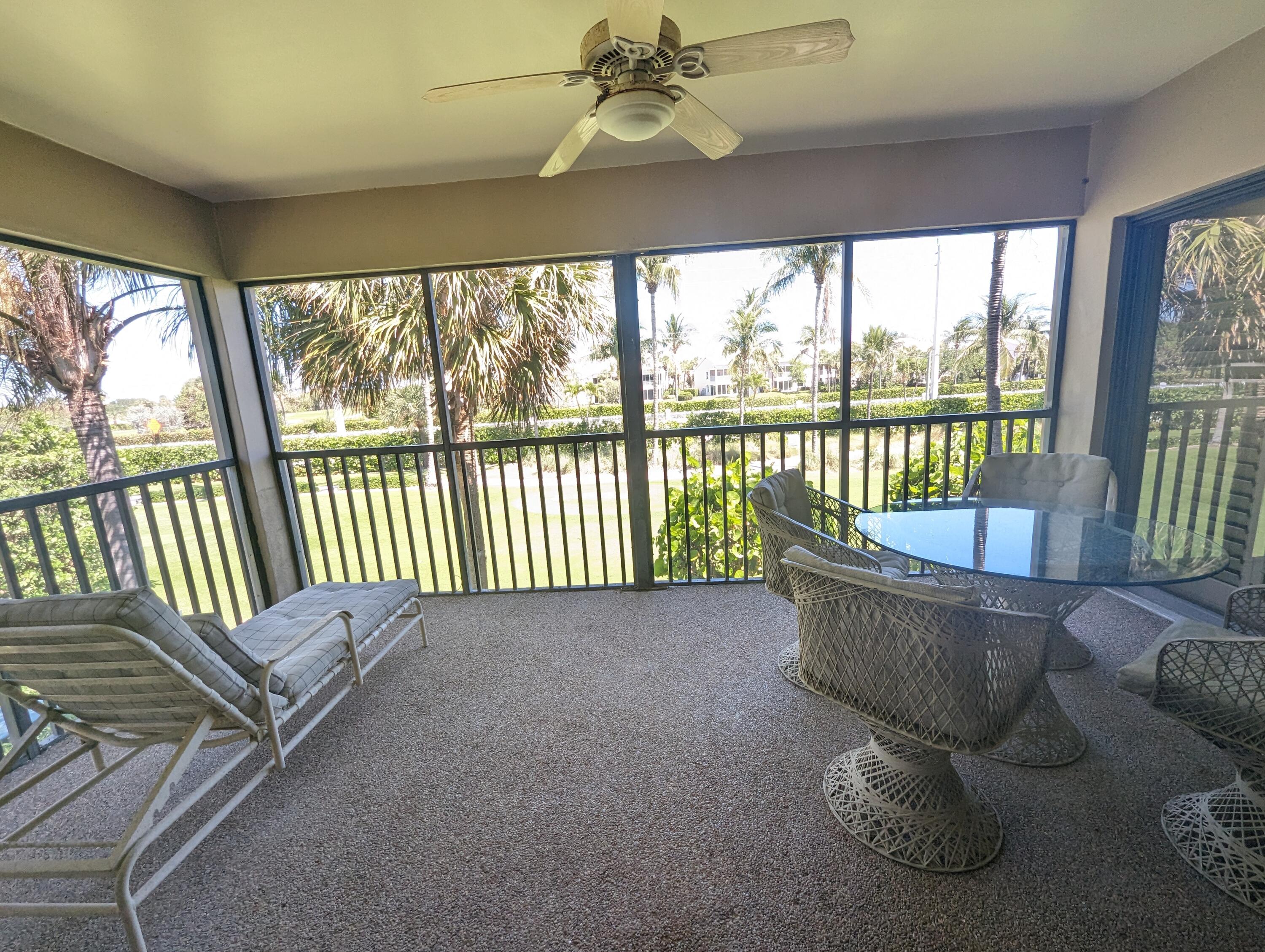 404 Clubhouse Circle Jupiter, FL 33477 - Photo 13 of 26 a view of a balcony with couch