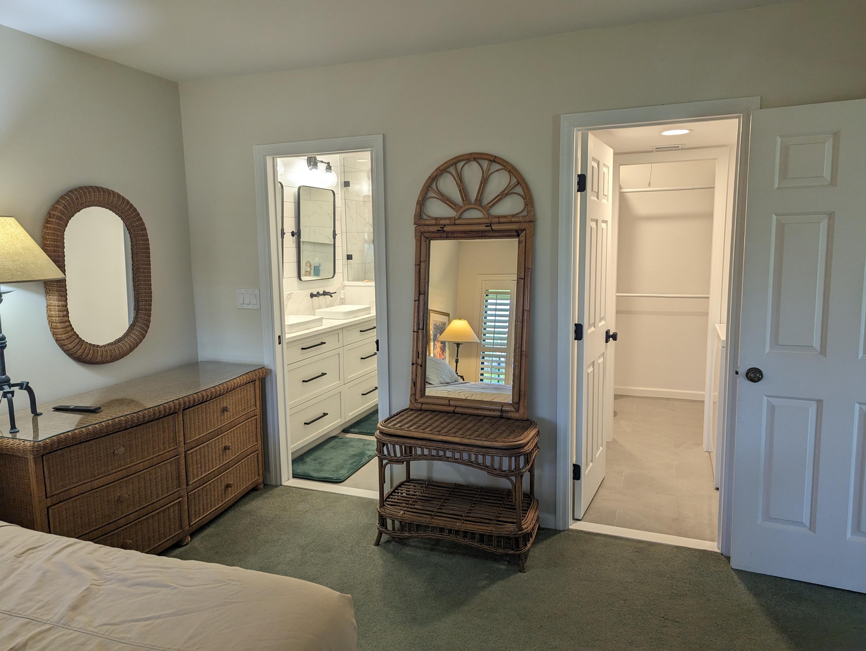 404 Clubhouse Circle Jupiter, FL 33477 - Photo 19 of 26 a spacious bedroom with a bed and a dresser