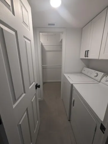 a bedroom with a bed chair and window