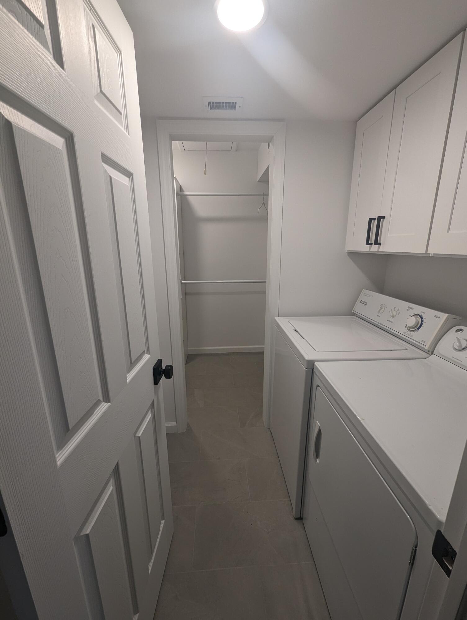 404 Clubhouse Circle Jupiter, FL 33477 - Photo 22 of 26 a utility room with dryer and washer