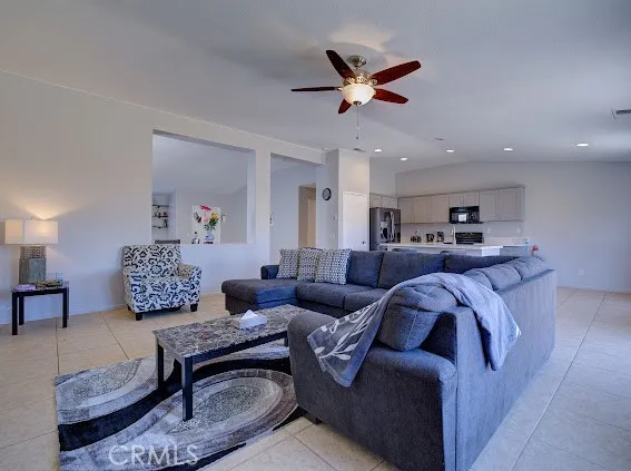 a kitchen with cabinets and chairs