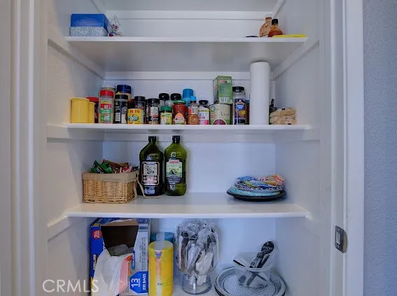 a kitchen with stainless steel appliances granite countertop a refrigerator stove and microwave