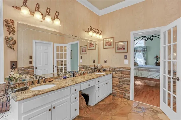 a bathroom with a bathtub and next to a window