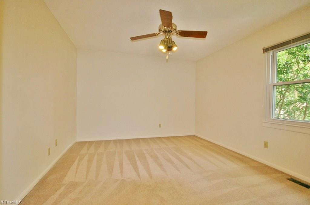 5725 Bramblegate Road, Unit A Greensboro, NC 27409 - Photo 11 of 28 Master Bedroom has ceiling fan, full bathroom, and huge walk-in closet!
