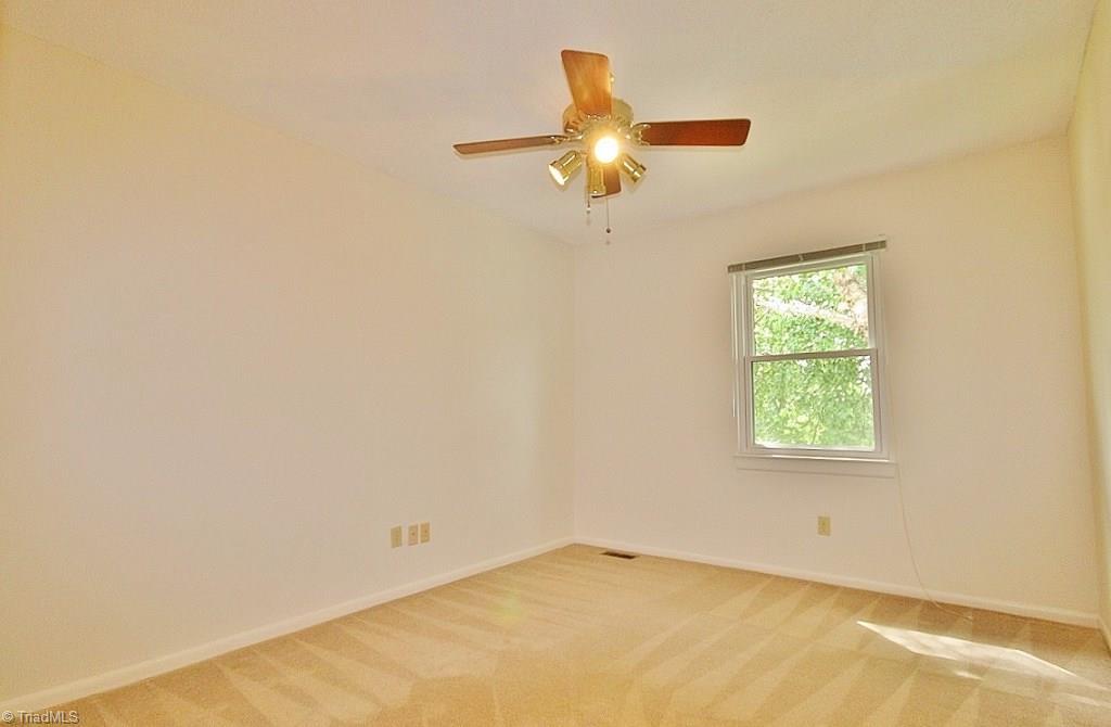 5725 Bramblegate Road, Unit A Greensboro, NC 27409 - Photo 14 of 28 Guest Bedroom (Bedroom 2 in listing), also has ceiling fan & nice-size closet...