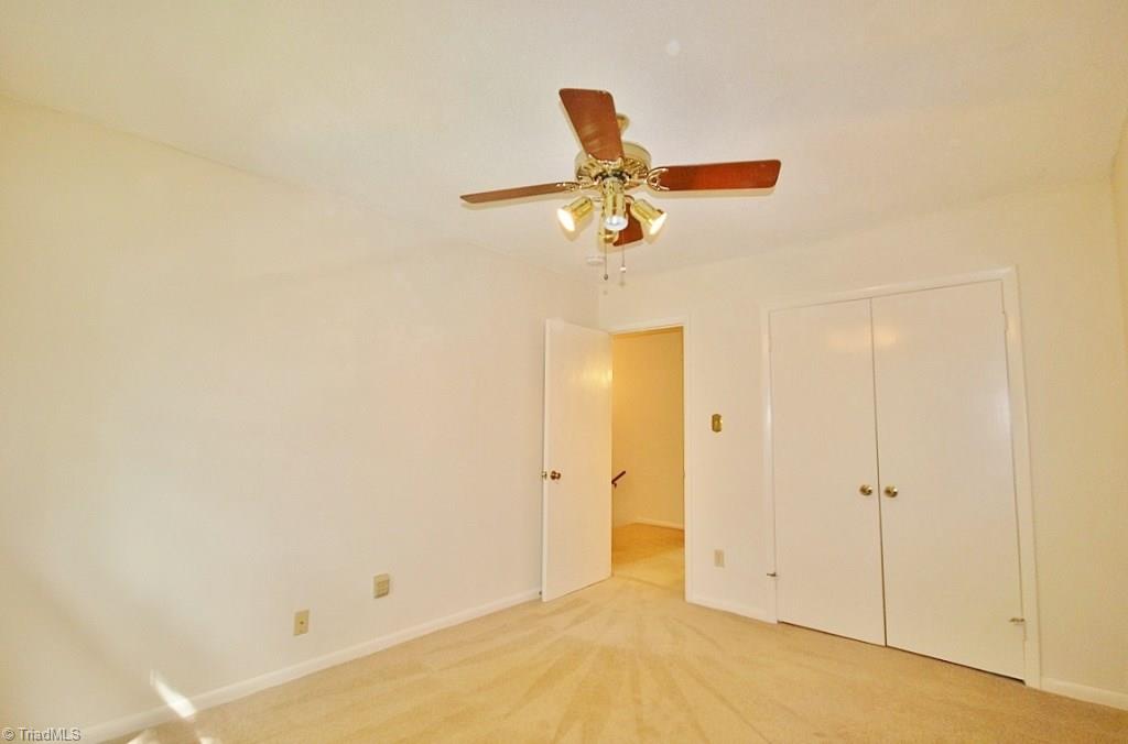 5725 Bramblegate Road, Unit A Greensboro, NC 27409 - Photo 15 of 28 Another view of Guest Bedroom (Bedroom 2 in listing), also has ceiling fan & nice-size closet...