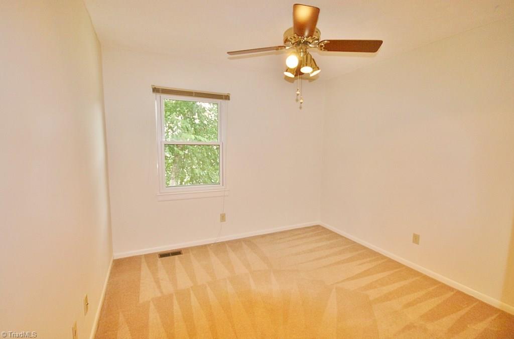 5725 Bramblegate Road, Unit A Greensboro, NC 27409 - Photo 17 of 28 Another view of Guest Bedroom (Bedroom 3 in listing), also has a ceiling fan & nice-size closet...