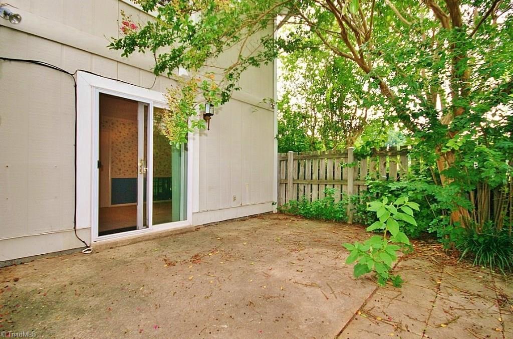 5725 Bramblegate Road, Unit A Greensboro, NC 27409 - Photo 19 of 28 Another view of back Patio & Privacy Fence...