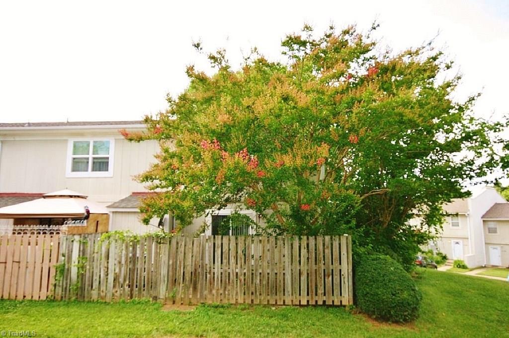 5725 Bramblegate Road, Unit A Greensboro, NC 27409 - Photo 20 of 28 Rear Exterior view of End Unit Condo....