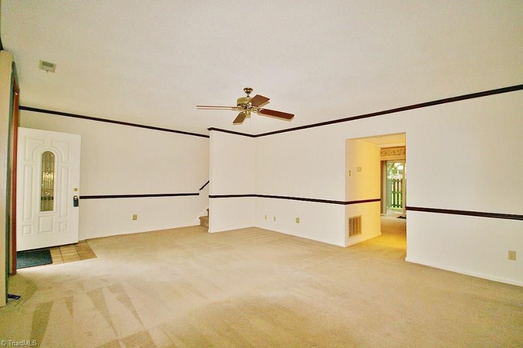5725 Bramblegate Road, Unit A Greensboro, NC 27409 - Photo 4 of 28 Large & open Living Room! View facing the end-side & back of the condo...