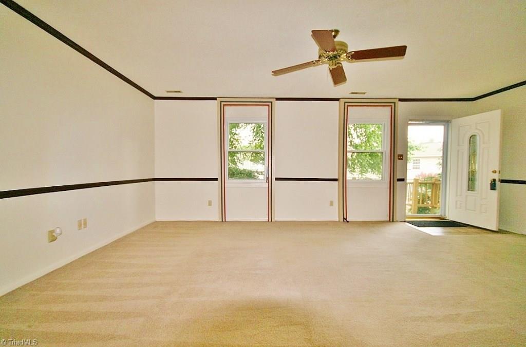 5725 Bramblegate Road, Unit A Greensboro, NC 27409 - Photo 5 of 28 Living Room view facing the front of the house...
