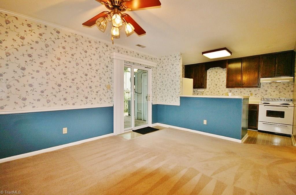 5725 Bramblegate Road, Unit A Greensboro, NC 27409 - Photo 7 of 28 Dining Room & Kitchen area with a Breakfast Bar! All appliances included!