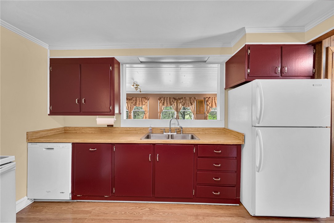 0 Cromer Road, Unit 245 CROMER ROAD Williamston, SC 29697 - Photo 20 of 24 This kitchen offers functional cabinetry, durable flooring, and ample counter space for daily living.