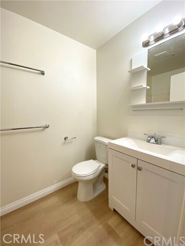 329 Genoa Street, Unit C Monrovia, CA 91016 - Photo 6 of 11 a bathroom with a sink and a toilet