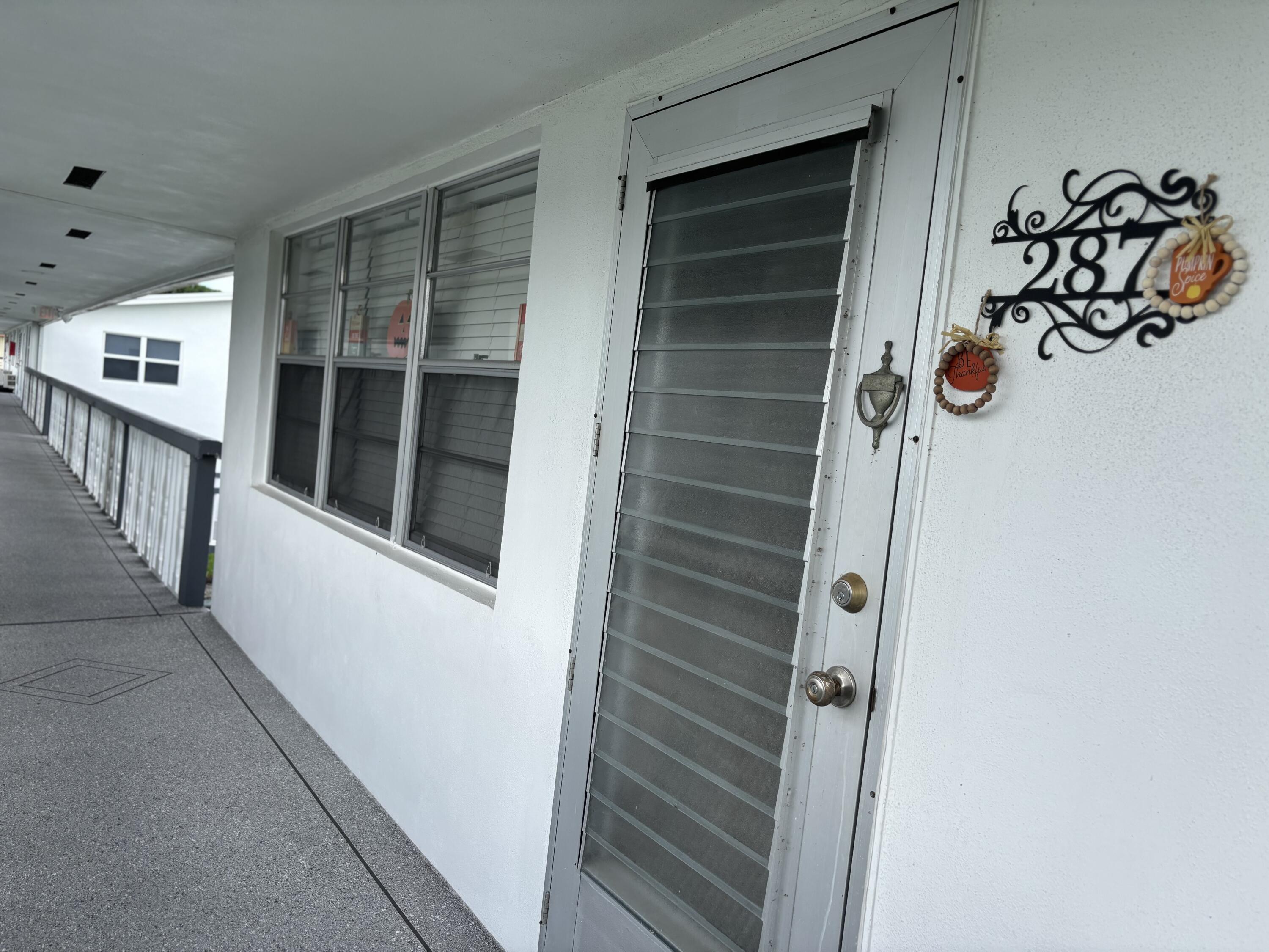 287 Camden L, Unit 287 West Palm Beach, FL 33417 - Photo 18 of 18 FRONT DOOR