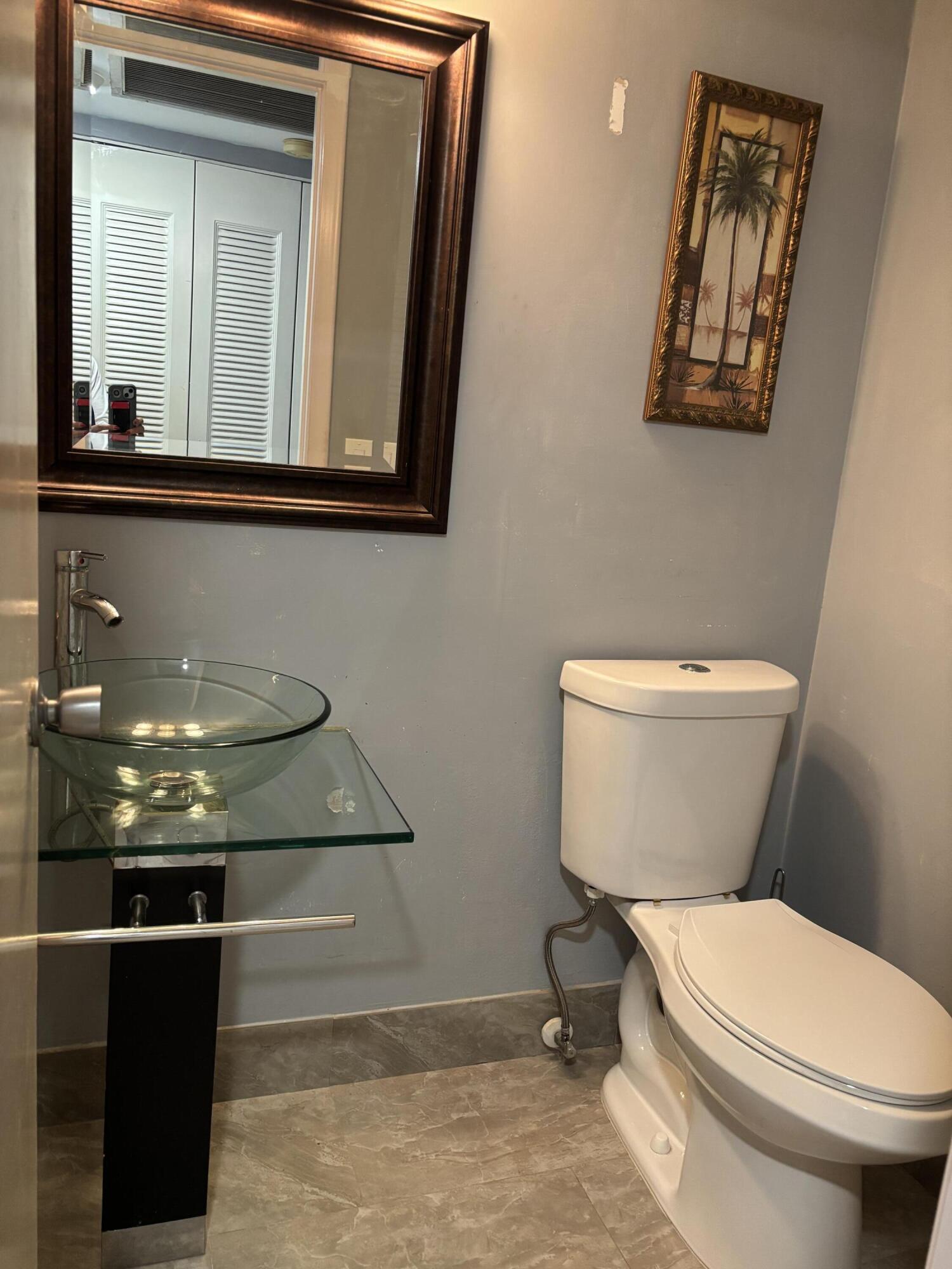 287 Camden L, Unit 287 West Palm Beach, FL 33417 - Photo 8 of 18 HALF BATHROOM