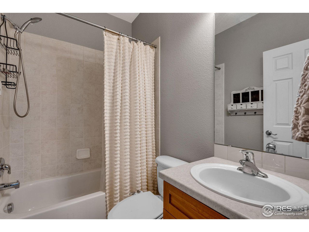 4115 Frederick Circle Longmont, CO 80503 - Photo 20 of 39 a bathroom with a sink and a mirror
