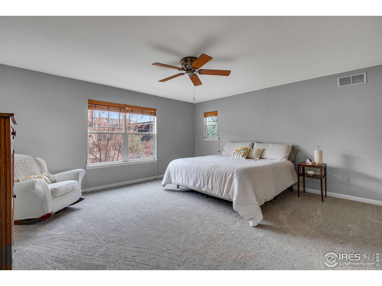 4115 Frederick Circle Longmont, CO 80503 - Photo 23 of 39 a bedroom with a bed and a couch