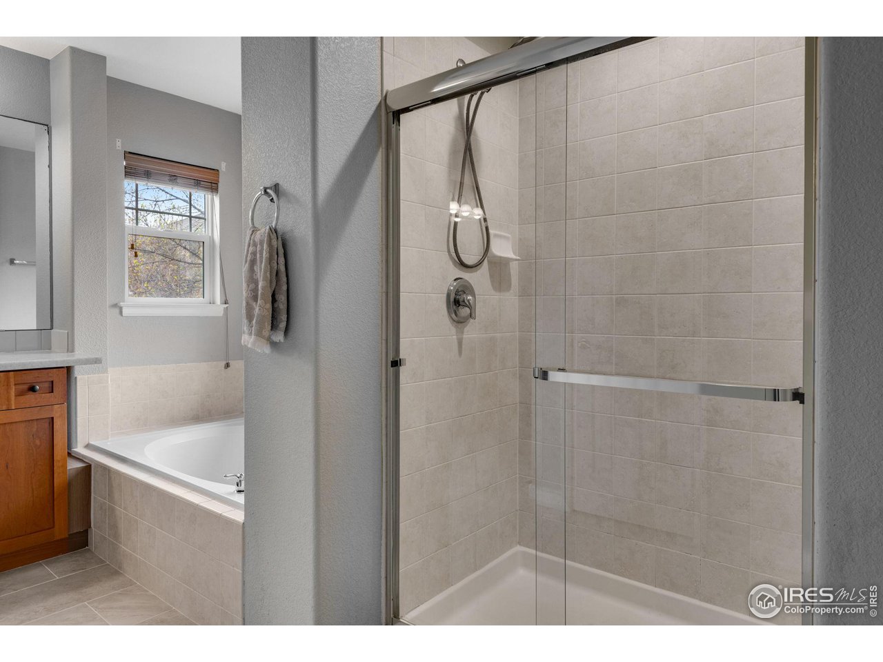 4115 Frederick Circle Longmont, CO 80503 - Photo 27 of 39 a bathroom with a bathtub and a shower