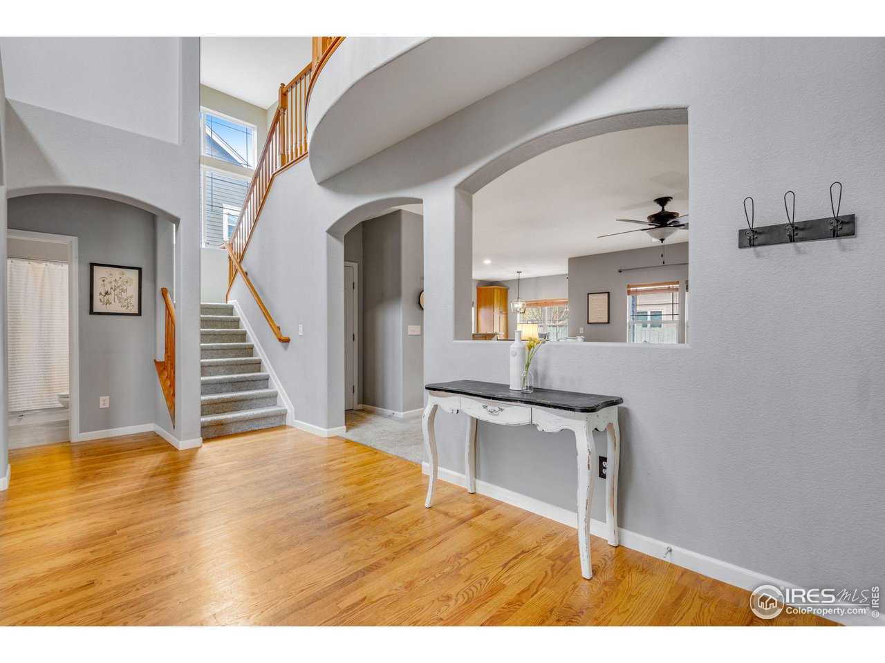 4115 Frederick Circle Longmont, CO 80503 - Photo 5 of 39 a view of a livingroom with wooden floor and furniture