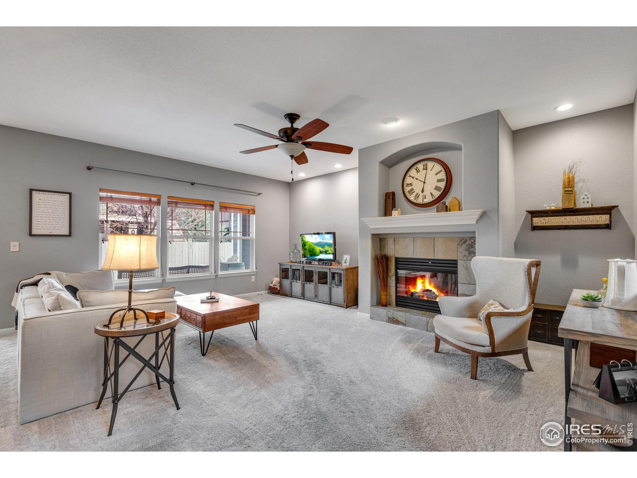 4115 Frederick Circle Longmont, CO 80503 - Photo 7 of 39 a living room with furniture and a fireplace