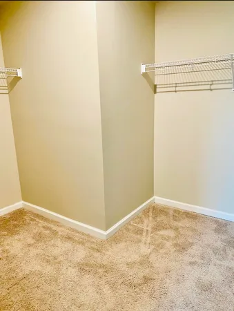 a bathroom with a granite countertop sink and a large mirror