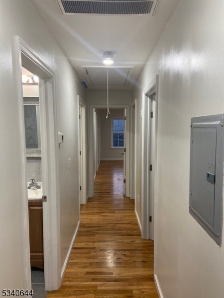 455 South 14th Street, Unit 3 Newark, NJ 07103 - Photo 7 of 10 a view of a hallway with wooden floor and staircase