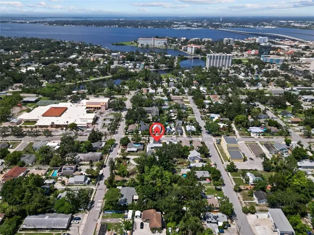 an aerial view of residential houses with city view