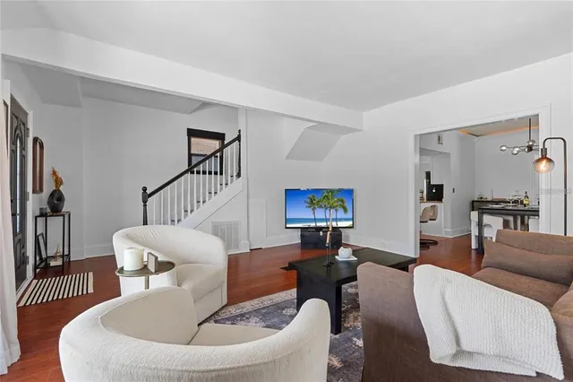 a living room with furniture and a painting