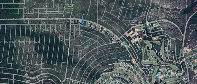 an aerial view of a house with a lake view