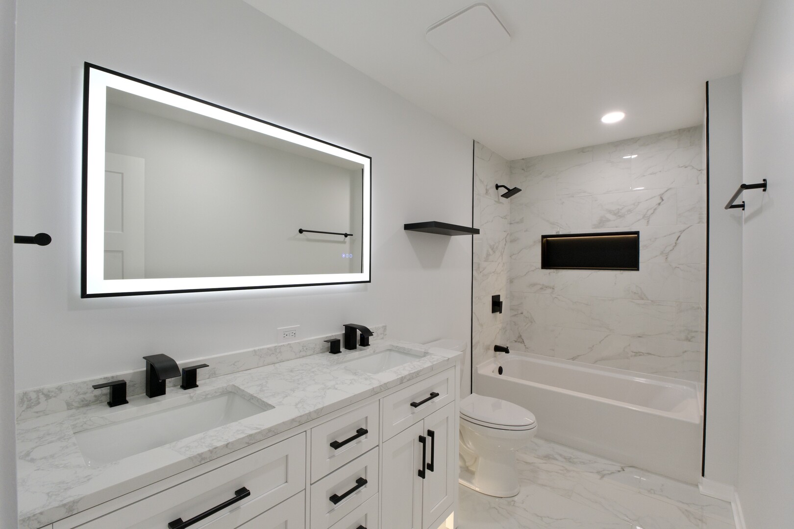 1406 Ridgeway Street Round Lake Beach, IL 60073 - Photo 13 of 33 a bathroom with a granite countertop sink a toilet a mirror and shower