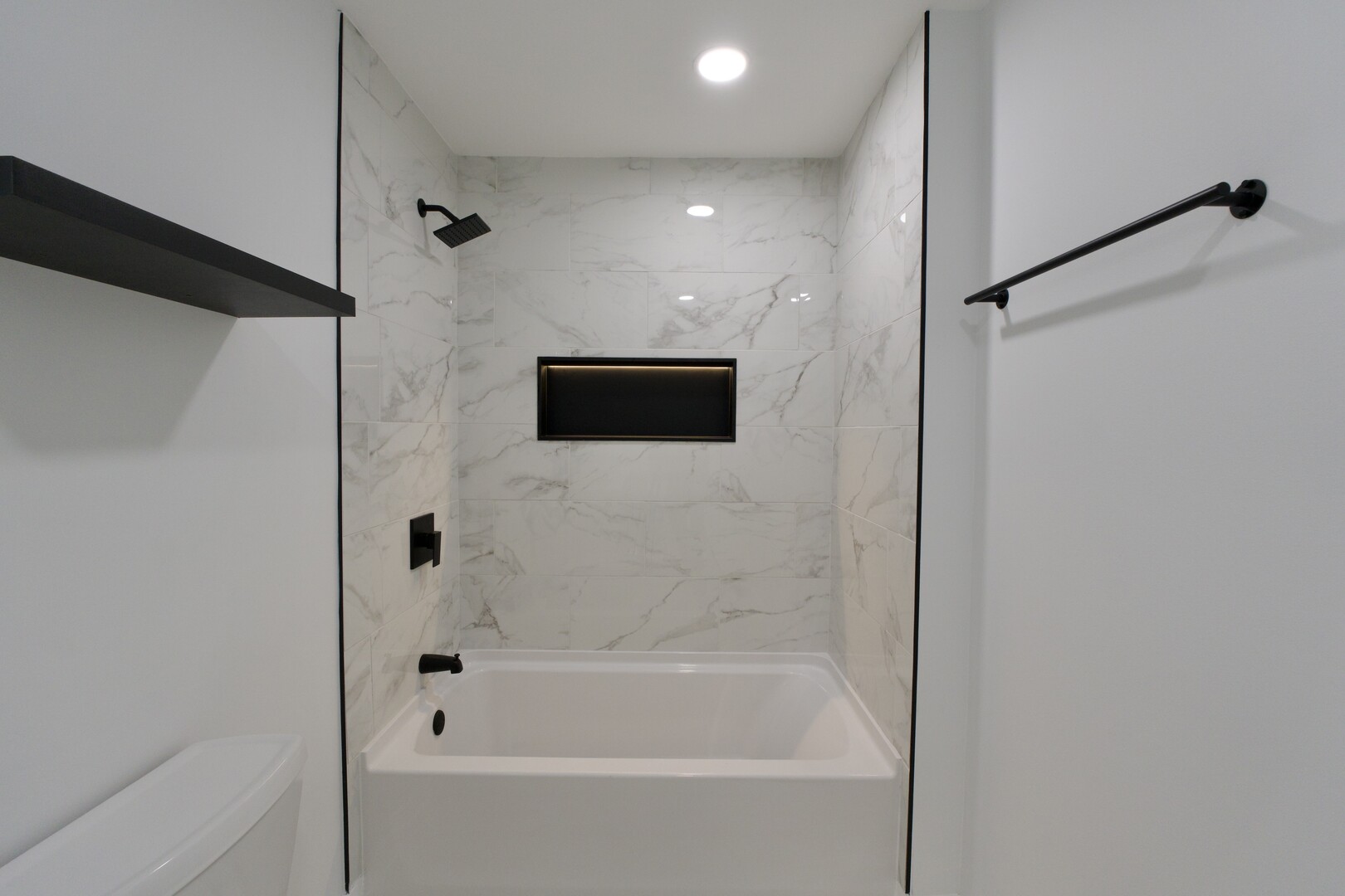 1406 Ridgeway Street Round Lake Beach, IL 60073 - Photo 14 of 33 a bathroom with a bathtub and a shower