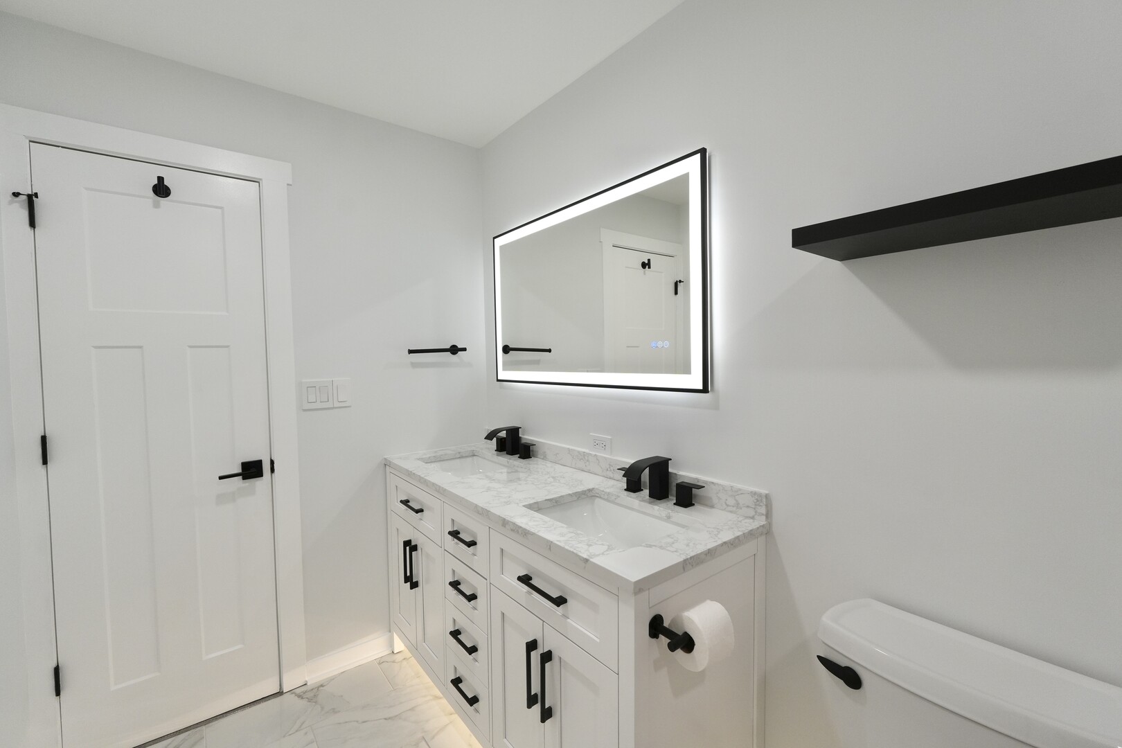 1406 Ridgeway Street Round Lake Beach, IL 60073 - Photo 15 of 33 a bathroom with a sink and a mirror