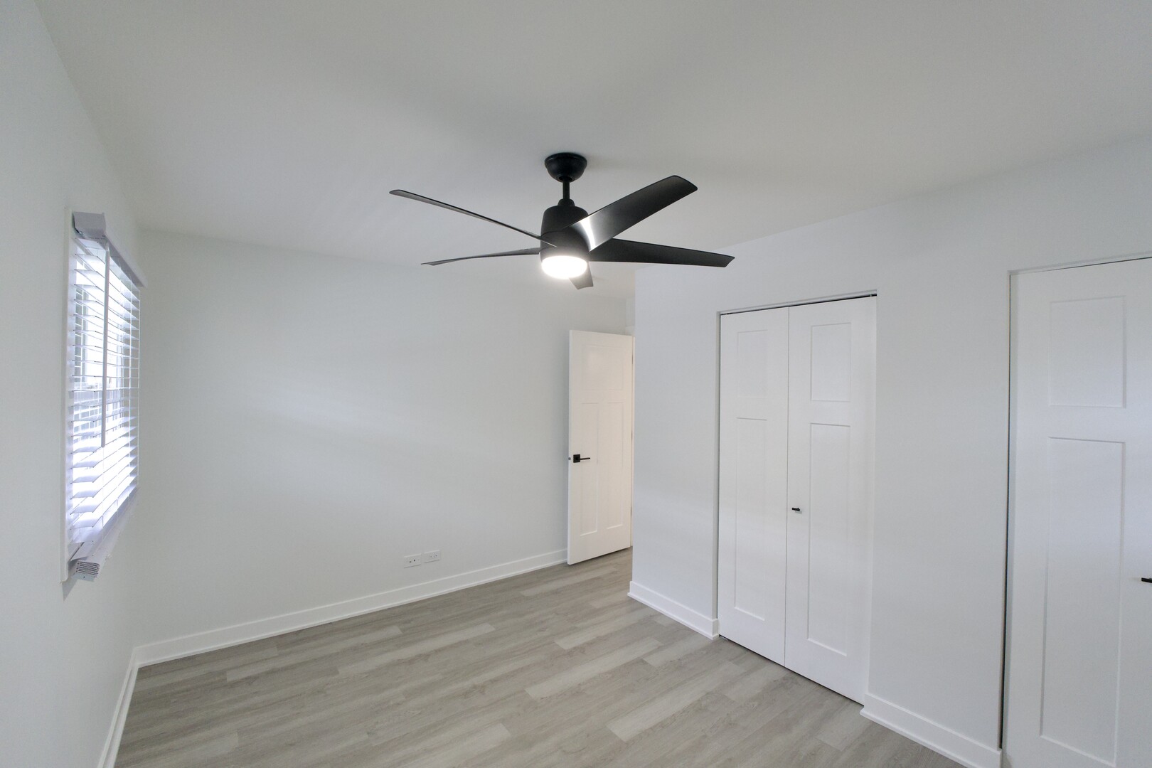 1406 Ridgeway Street Round Lake Beach, IL 60073 - Photo 16 of 33 a view of empty room with ceiling fan