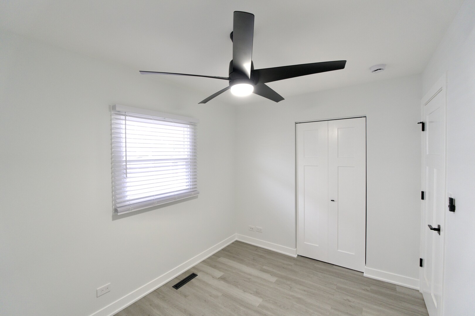 1406 Ridgeway Street Round Lake Beach, IL 60073 - Photo 20 of 33 a view of an empty room with a window