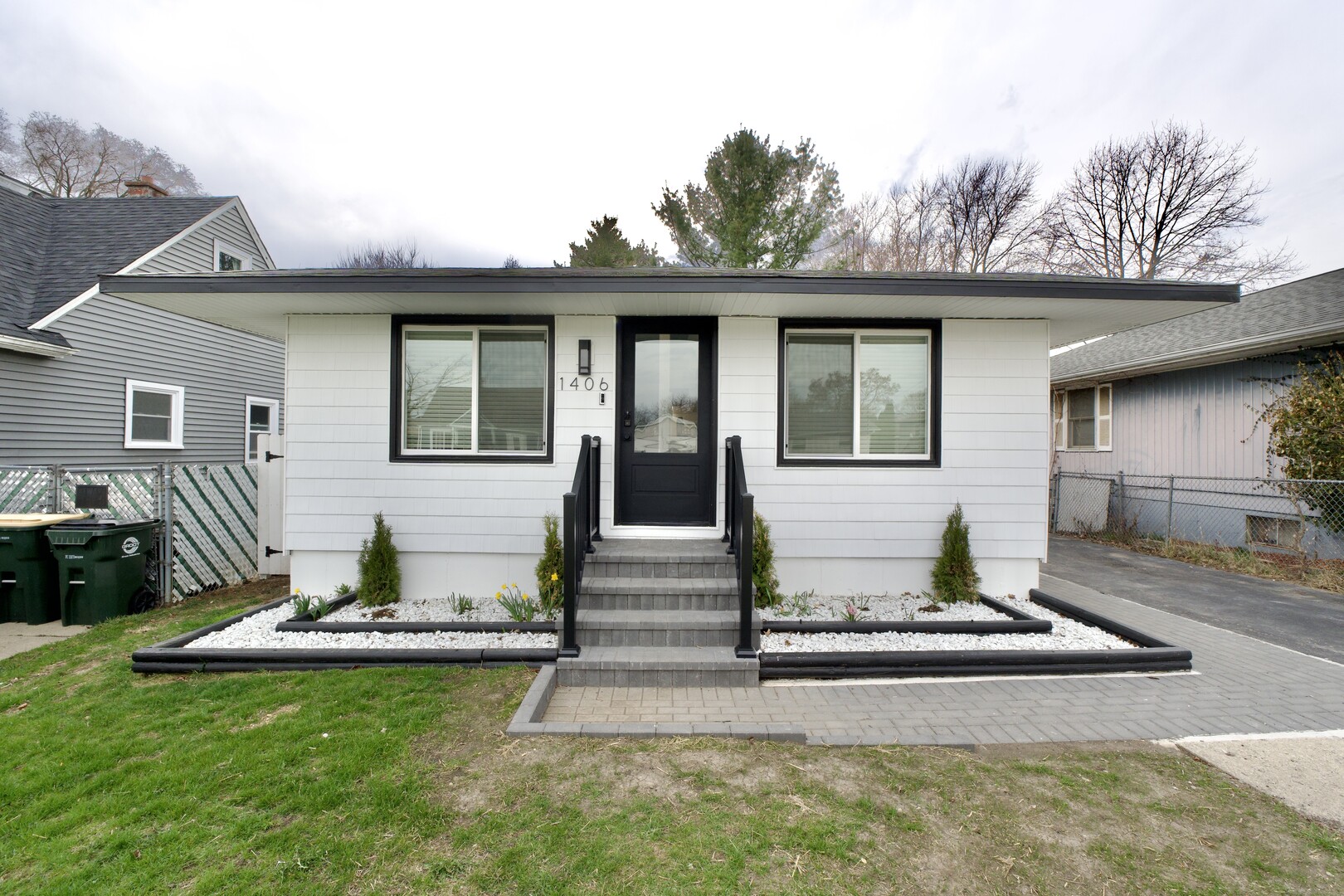 1406 Ridgeway Street Round Lake Beach, IL 60073 - Photo 2 of 33 a front view of a house with garden