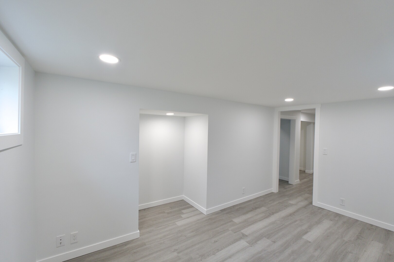 1406 Ridgeway Street Round Lake Beach, IL 60073 - Photo 26 of 33 an empty room with wooden floor and windows