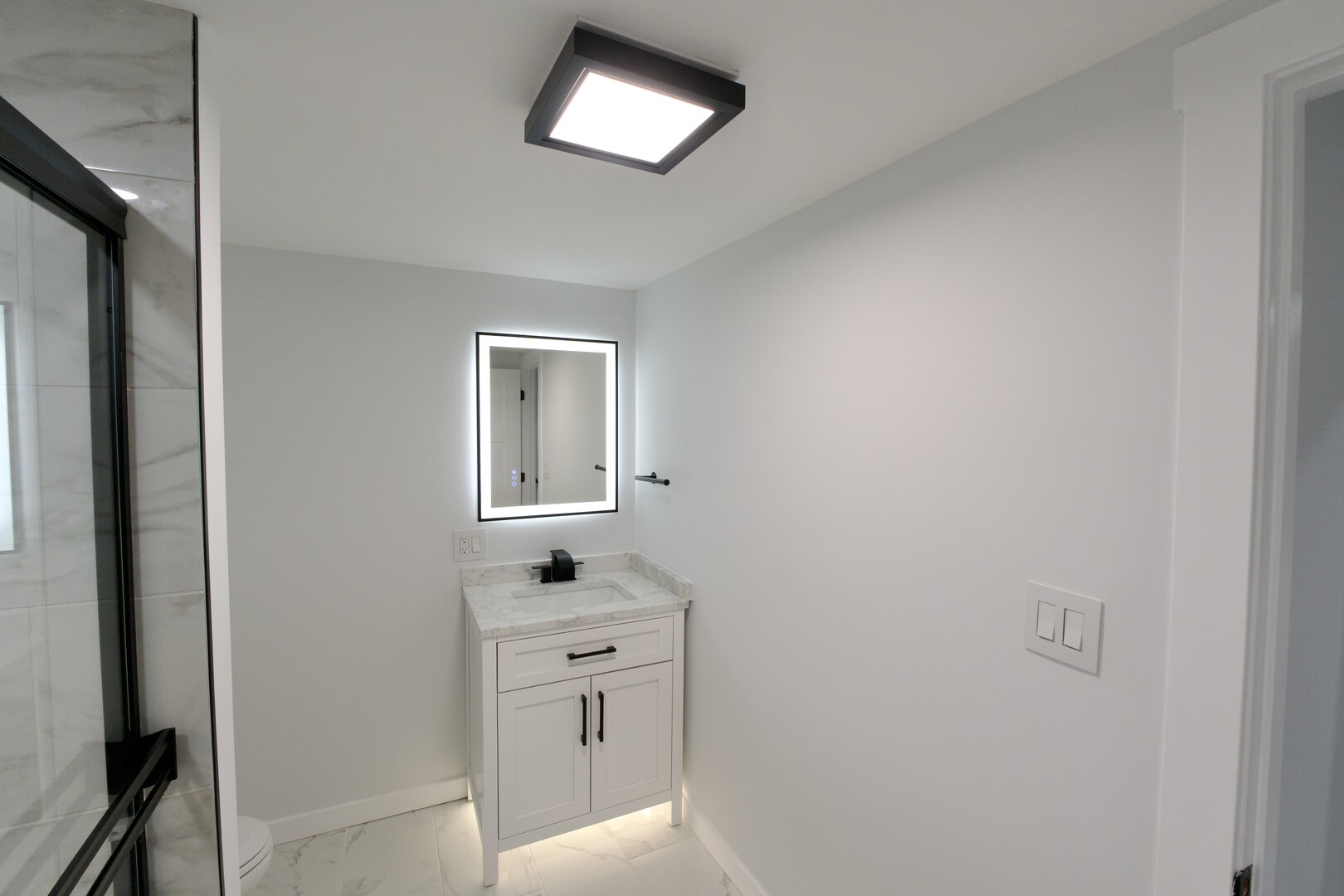 1406 Ridgeway Street Round Lake Beach, IL 60073 - Photo 31 of 33 a room with a bed and a lamp