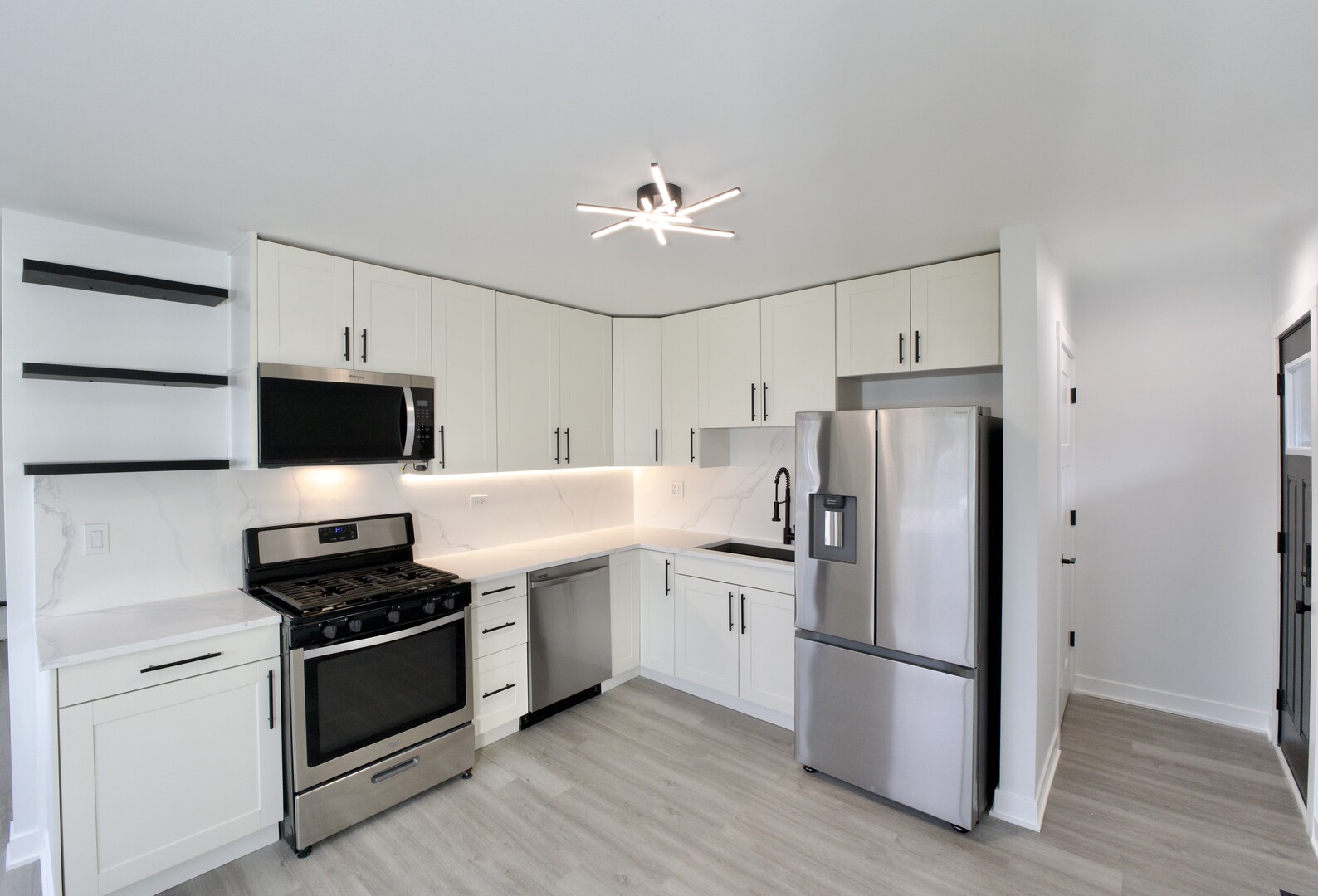 1406 Ridgeway Street Round Lake Beach, IL 60073 - Photo 6 of 33 a kitchen with a refrigerator stove and microwave