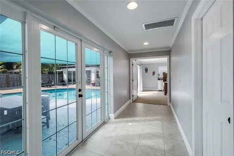 a bathroom with a glass door shower and sink