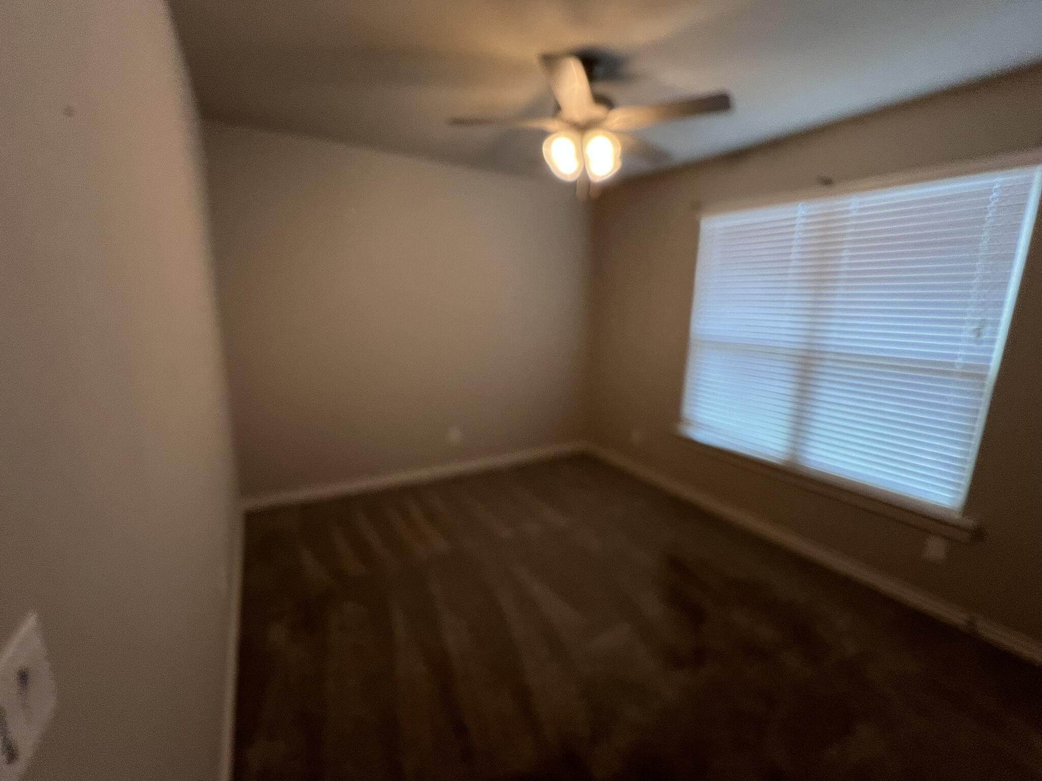 816 North 3rd Street Wolfforth, TX 79382 - Photo 14 of 28 a view of an empty room with a window